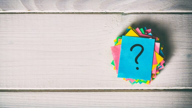 just a lot of question marks on colored papers. vintage background